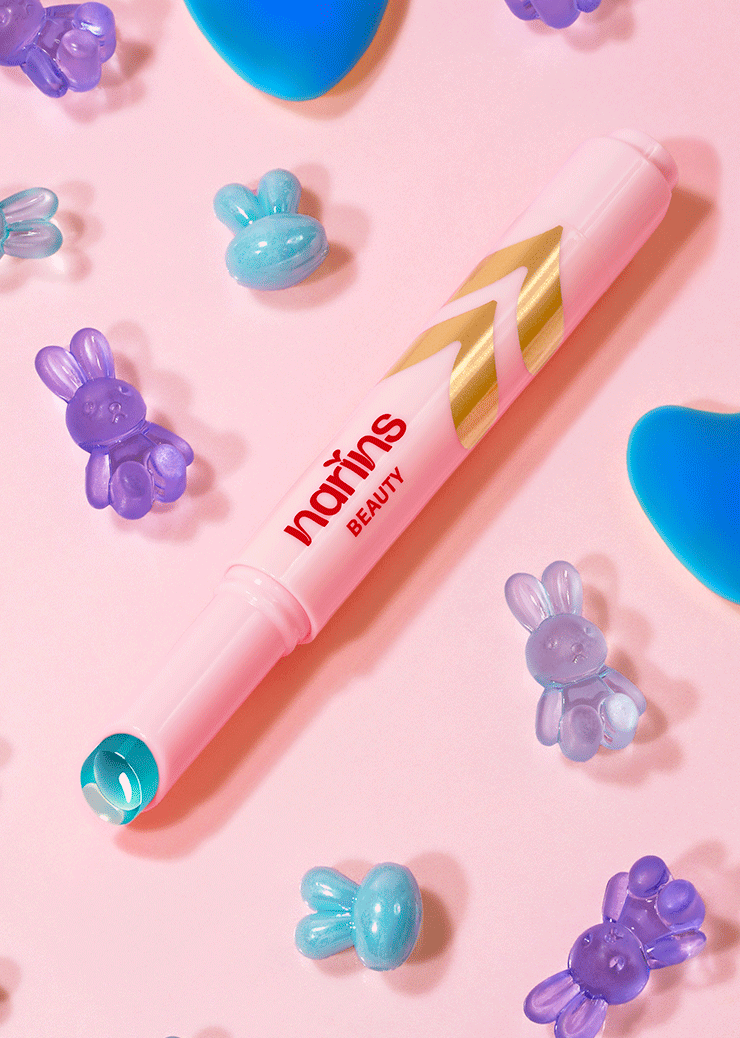 Pink lip tint with 'narins beauty' branding on a pink background with decorative elements.